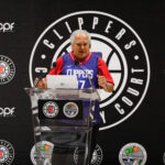 A man speaking at a Clippers sports press conference.