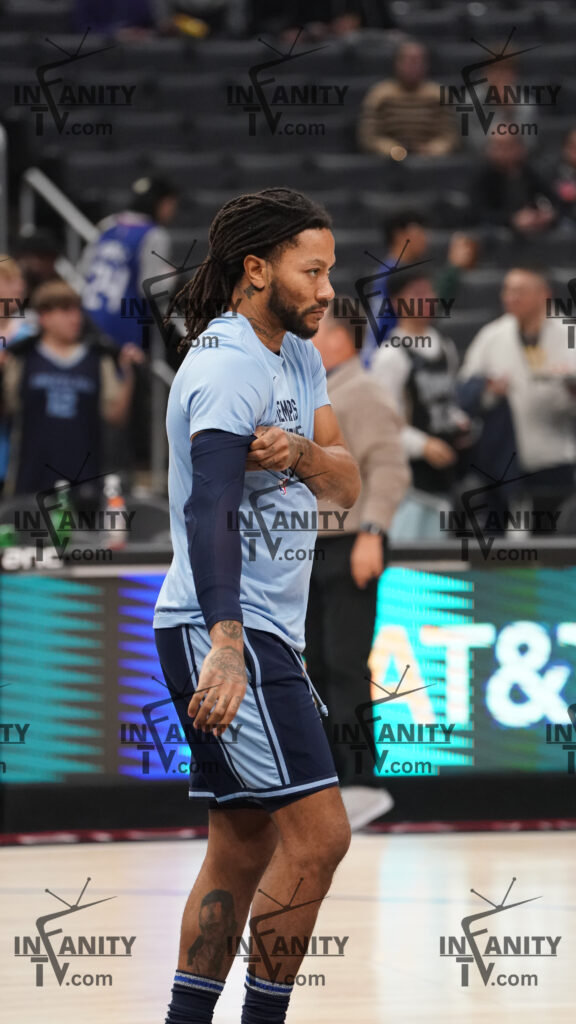 Basketball player in light blue uniform preparing on court.