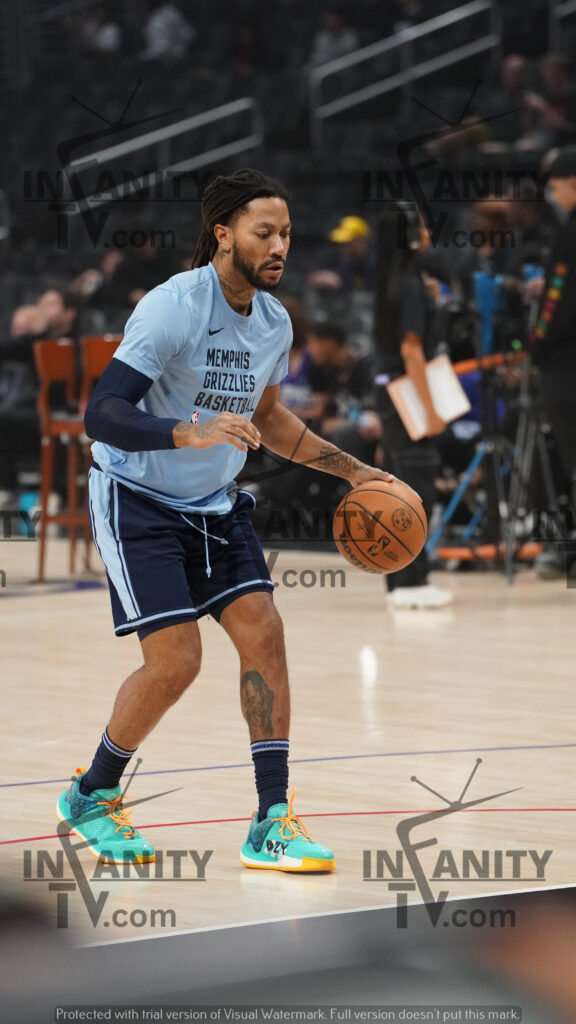 Basketball player dribbling on court during practice.
