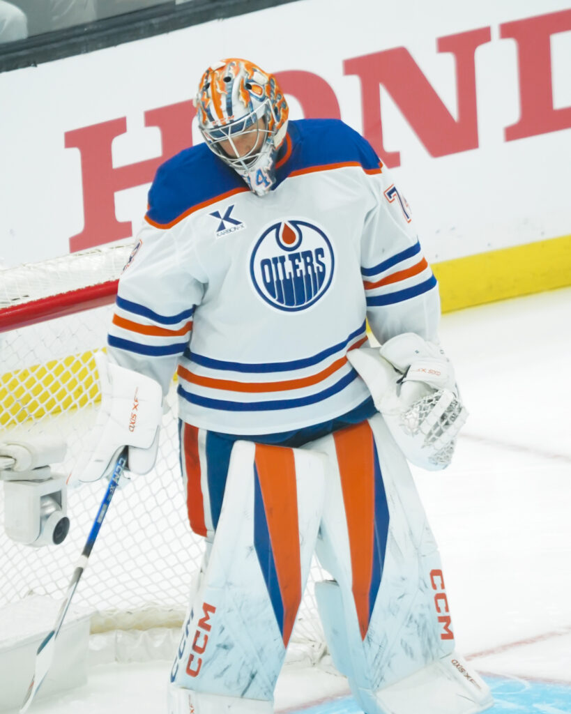 Edmonton Oilers goalie in full gear during a game.