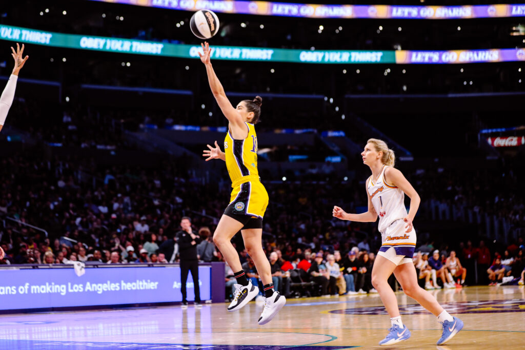 Is This a Championship Hangover or Something More? Inside the Kings’ Puzzling Mid-Season Slump Female basketball player in yellow uniform jumps for a shot during a game.