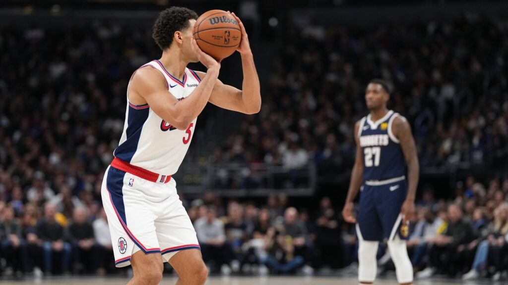 A Clippers player in a white jersey lines up a free throw as a Denver Nuggets player waits on the lane