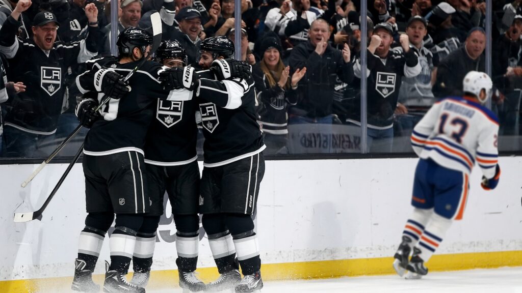 Kings vs Oilers Game Day: New Lines, a Five-on-Three Fix and Connor McDavid’s 800th Game at Crypto.com Arena Kings players in black home jerseys celebrate a goal against the glass as fans cheer and an Edmonton Oilers player skates away